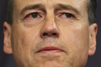 Health and Aged Care Greg Hunt sheds a tear when speaking about threats to his family, during a press conference at Parliament House in Canberra. 