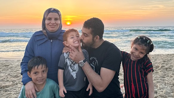 Palestinian poet Mosab Abu Toha with his family in an undated photo. They are now in Cairo.