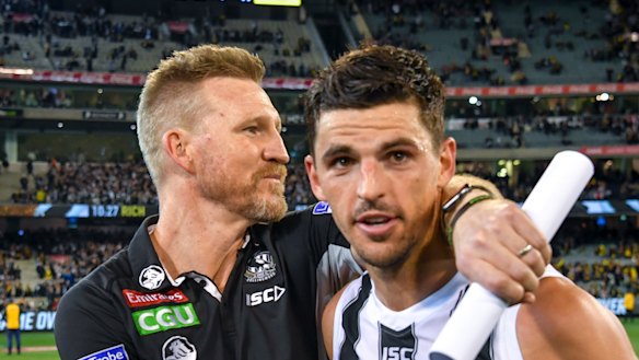 Nathan Buckley with Scott Pendlebury.