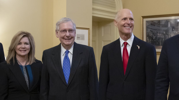 Florida's Rick Scott (right) arrived for the first day of the new Congress on Wednesday despite the result not being finalised yet.
