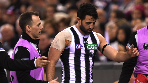 Alex Fasolo heading from the field  on Saturday with a suspected ankle injury.
