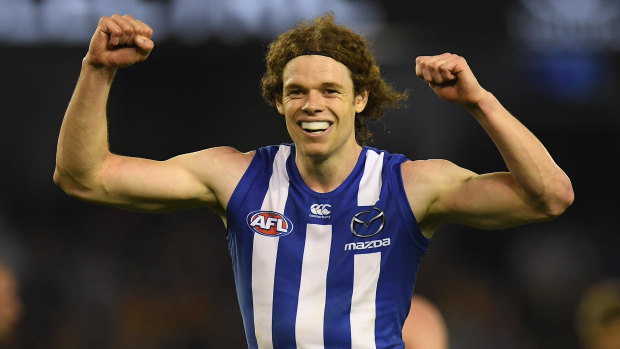 Gun forward:  North Melbourne's Ben Brown celebrates after booting a goal against Hawthorn.