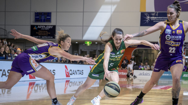 Fancy footwork: Ranger Tessa Lavey splits the Boomers’ defenders Jenna O’Hea and Cayla Geoirge.