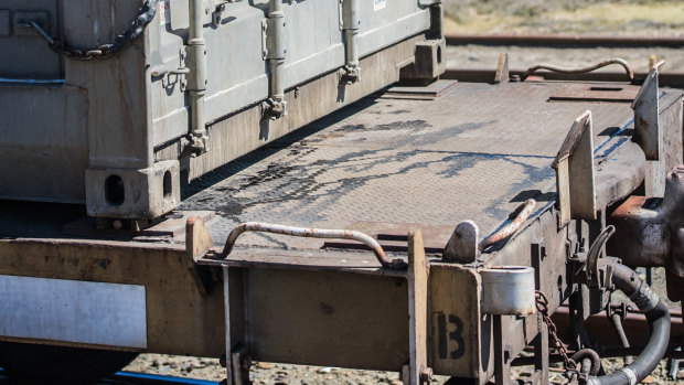 One of the containers on a waste train, which was visibly leaking when it stopped on the siding at Tarago Railway Station on Friday.