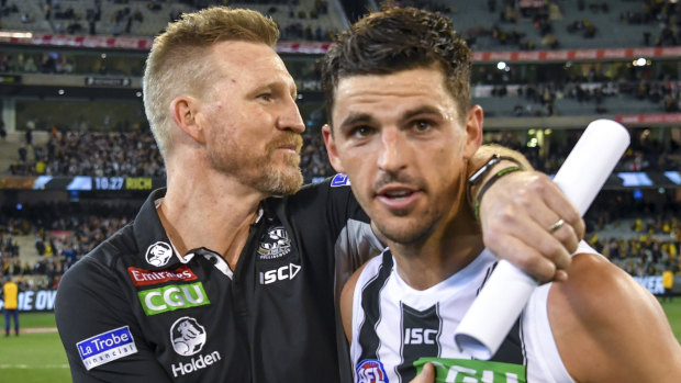 Nathan Buckley with Scott Pendlebury.