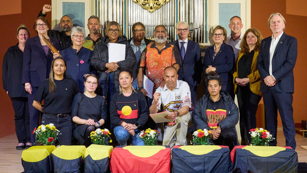 Members of the First Peoples delegation and officials at the ceremony in Leipzig. 