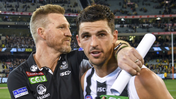 Nathan Buckley with Scott Pendlebury.