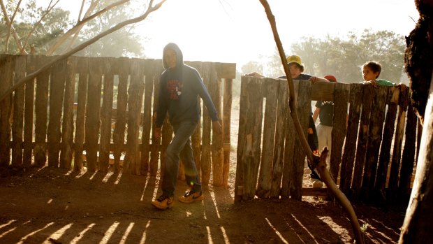 Children from Iga Warta on Adnyamathanha land playing among the cooking smoke.