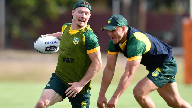 Fresh face: Damien Cook (left) is one of four Kangaroos players who will be making their Test debuts.