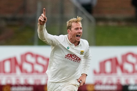 South Africa’s Simon Harmer celebrates the wicket of Australia’s Beau Webster on day four.