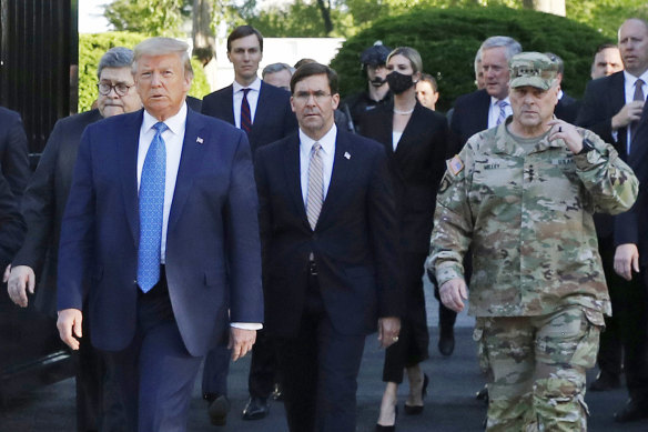 Milley, right, said he felt Trump used him as part of a photo op in his walk across Lafayette Square in June 2020.