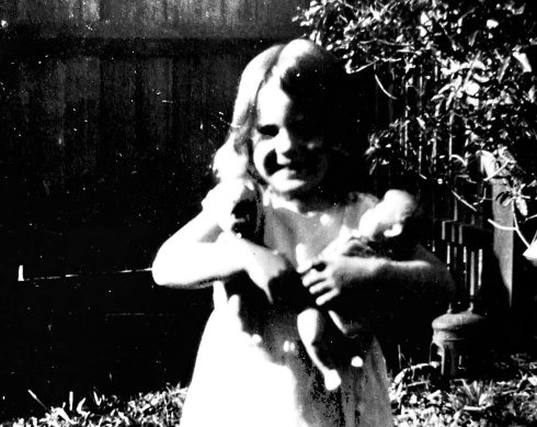 Rhodesia aged four years old, in the late 1920s, with her dolls.