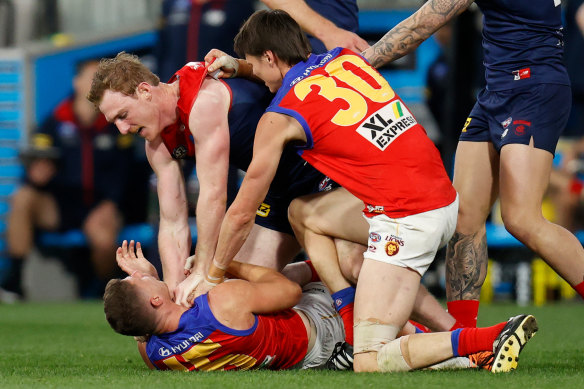 The Brisbane Lions and Melbourne had a fierce tussle at the MCG before the Demons’ season ended.