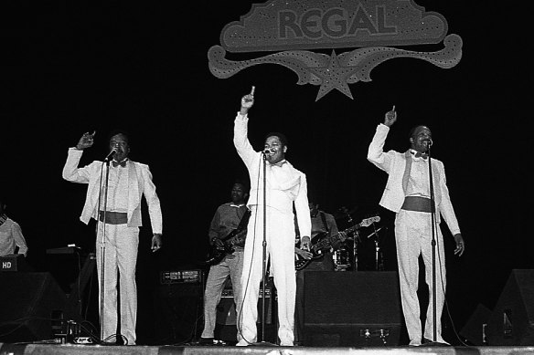 Singers Major Harris, Garfield Fleming and William Hart of the Delfonics performs at the Regal Theater in Chicago, Illinois in May 1989. 