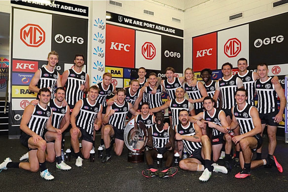 Port Adelaide players changed into the “prison bar” jumper in 2021 to celebrate a Showdown victory.