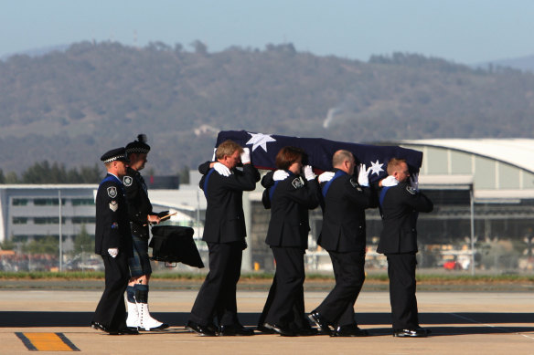 The arrival of Morgan Mellish’s coffin in Canberra.