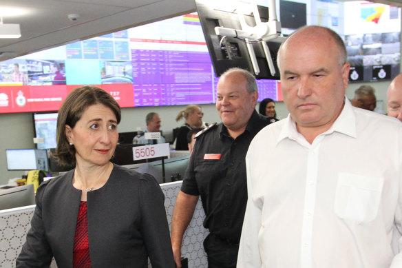 NSW Emergency Services Minister David Elliott walks with Premier Gladys Berejiklian at RFS headquarters in Sydney. 