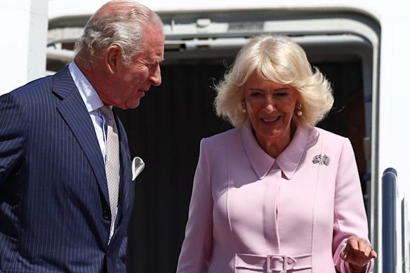 Queen Camilla, wearing the Union Jack and the Stars and Stripes brooch, arrives with King Charles.