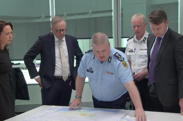 Prime Minister Anthony Albanese (second from left) and Acting Premier Ben Carroll (far right) visited the Victorian State Control Centre in Melbourne for a briefing on the floods on January 10.