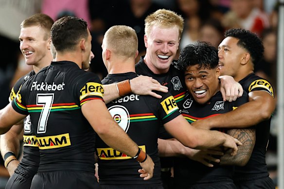 The Panthers celebrate Brian To’o’s try on Friday night.