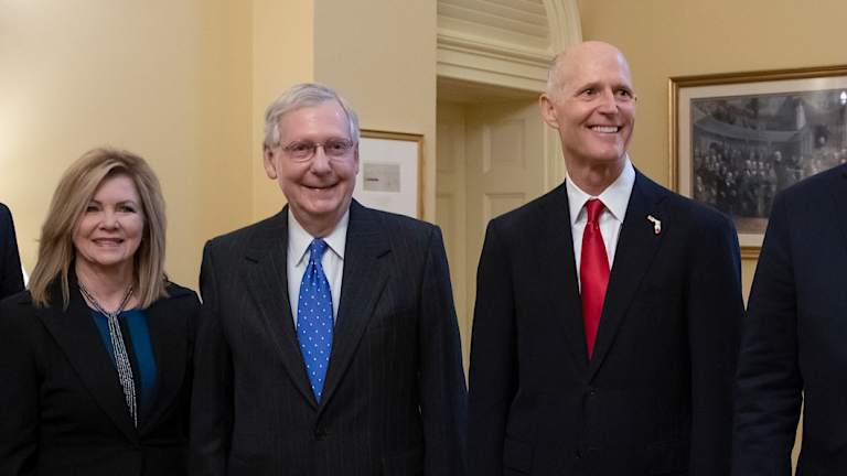 Florida's Rick Scott (right) arrived for the first day of the new Congress on Wednesday despite the result not being finalised yet.