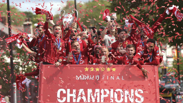 The players, the trophy and the open-top bus.