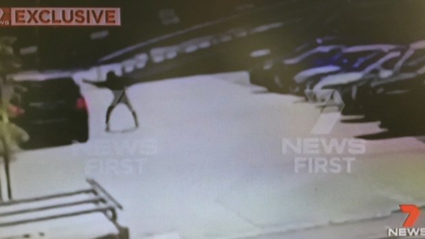 Footage shows the balaclava-clad gunman firing a barrage of bullets into the driver's side window of Hawi's car.