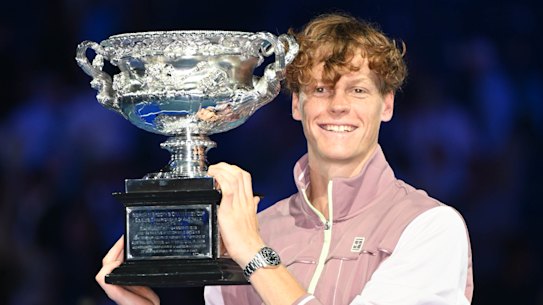 Jannik Sinner with his maiden grand slam trophy for winning the 2024 Australian Open men’s singles.