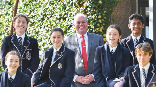 Mentone Grammar principal Mal Cater and Year 8 students in 2019.