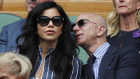 Amazon Founder and CEO Jeff Bezos, right, and Lauren Sanchez, watch Serbia's Novak Djokovic play Switzerland's Roger Federer during the men's singles final match of the Wimbledon Tennis Championships in London, Sunday, July 14, 2019. 