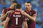 Darius Boyd embraces Billy Slater during their playing days.