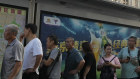 Residents line up for public transportation in Beijing.