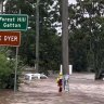 Risk rising: SES crews rescue motorists, with parts of Brisbane on flood alert