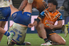 Leo Thompson flips on to his head after the tackle by Latu Fainu.