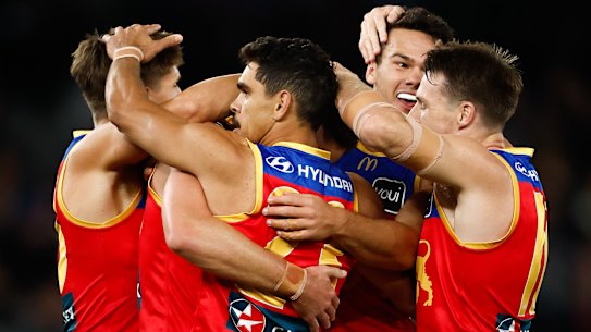 Brisbane celebrate a goal.