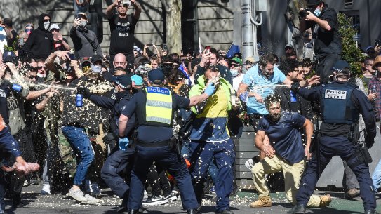 Anti Lockdown protest in Melbourne last month. Police and protesters clash in on Spring Street near Parliament House.