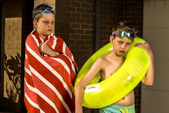 Vaughn (at left) and Alexander Dawson’s parents struggle to afford their swimming lessons.