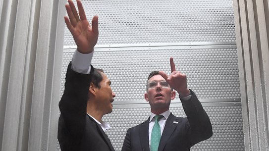 Premier Dominic Perrottet with Iwatani Corporation’s Yukio Awazu at the company’s liquified hydrogen tanks in Tokyo.