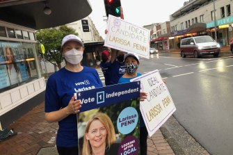 Supporters of independent candidate Larissa Penn outside Gladys Berejiklian’s electoral office before the byelection campaign kicked off.