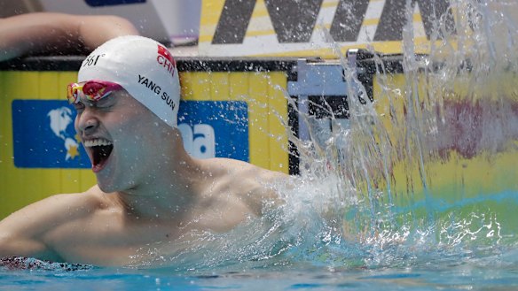 China's Sun Yang celebrates after winning the 200m freestyle by default.