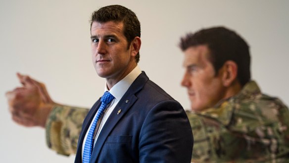 Ben Roberts-Smith in front of his portrait at the Australian War Memorial in Canberra.