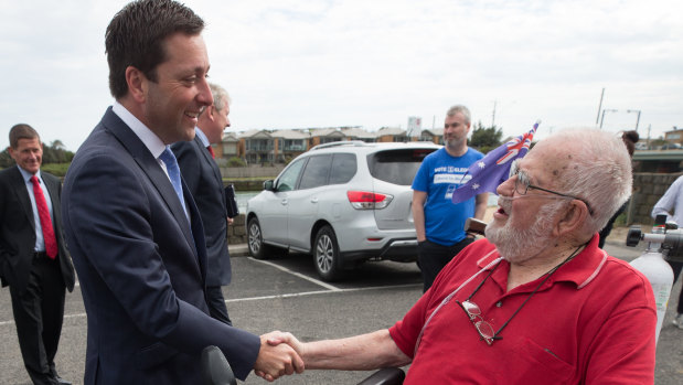 Matthew Guy (left) meets Liberal Party member Bill Walstab at Thursday's event. 
