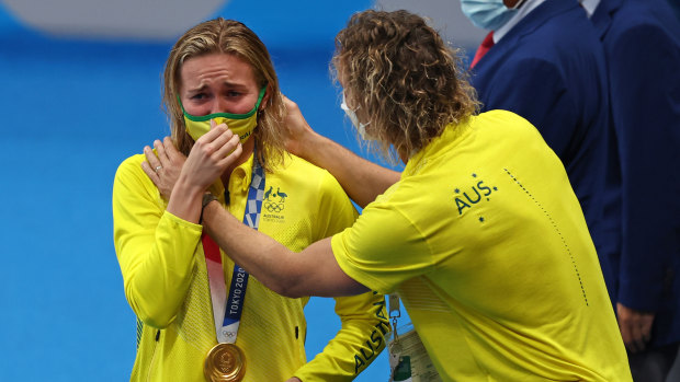 Ariarne Titmus and her coach, Dean Boxall, share a special moment