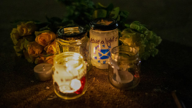 Candles and flowers are left during a gathering entitled 'Missing EU Already' near the Scottish Parliament in Edinburgh.