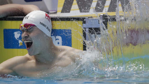 China's Sun Yang celebrates after winning the 200m freestyle by default.