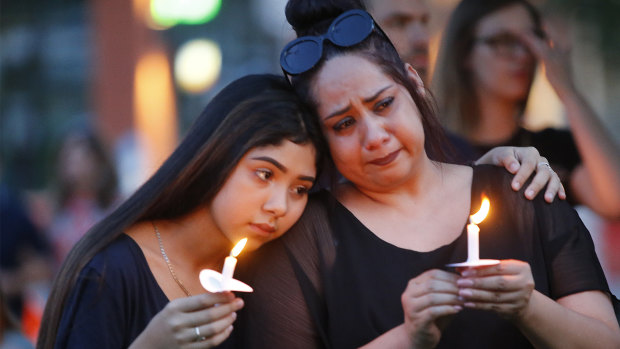 Texans hold candles during a vigil at in McKinney, Texas, after the El Paso massacre.  