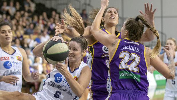 Snatch and grab raid: Adelaide's Steph Blicavs steals a rebound as the Lightning battle their way to a win in the first semi-final at the State Basketball Centre in Melbourne.