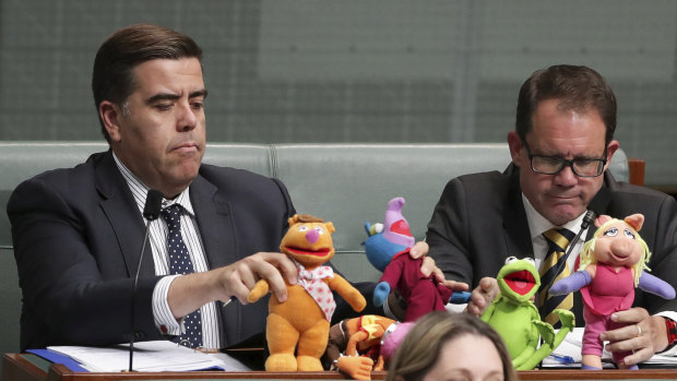 Milton Dick and Luke Gosling taunt the government with Muppets on their desks in 2018.