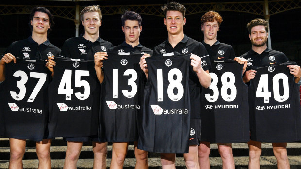 Fresh faces: Carlton's latest pick-ups (L-R) Ben Silvagni, Hugh Goddard, Liam Stocker, Sam Walsh, Finbar O’Dwyer, Tomas Bugg show off their new numbers.