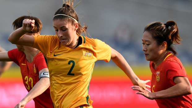 Comeback: Amy Harrison takes on China in her previous stint with the Matildas.